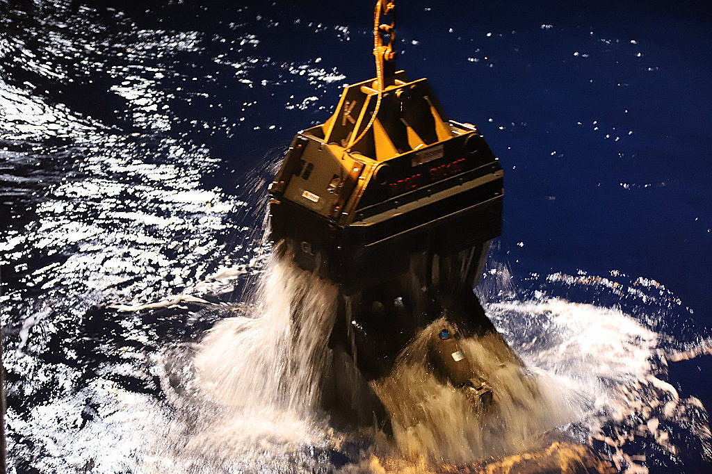 The grabber emerges from the water.